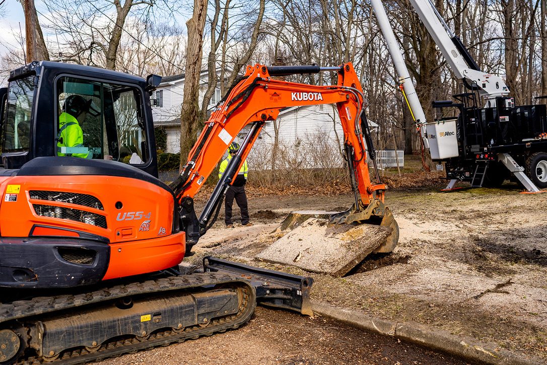 Kubota excavator on a stump job — Pro-Stump Tree Service