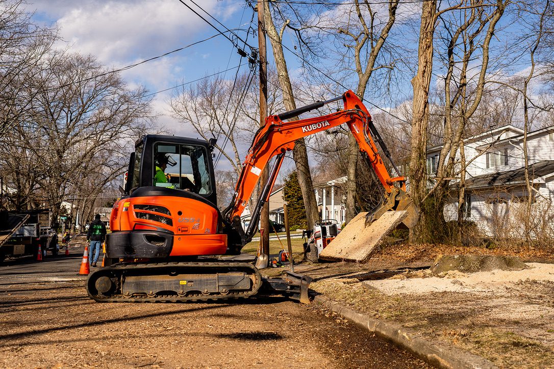 Kubota excavator on a stump job — Pro-Stump Tree Service