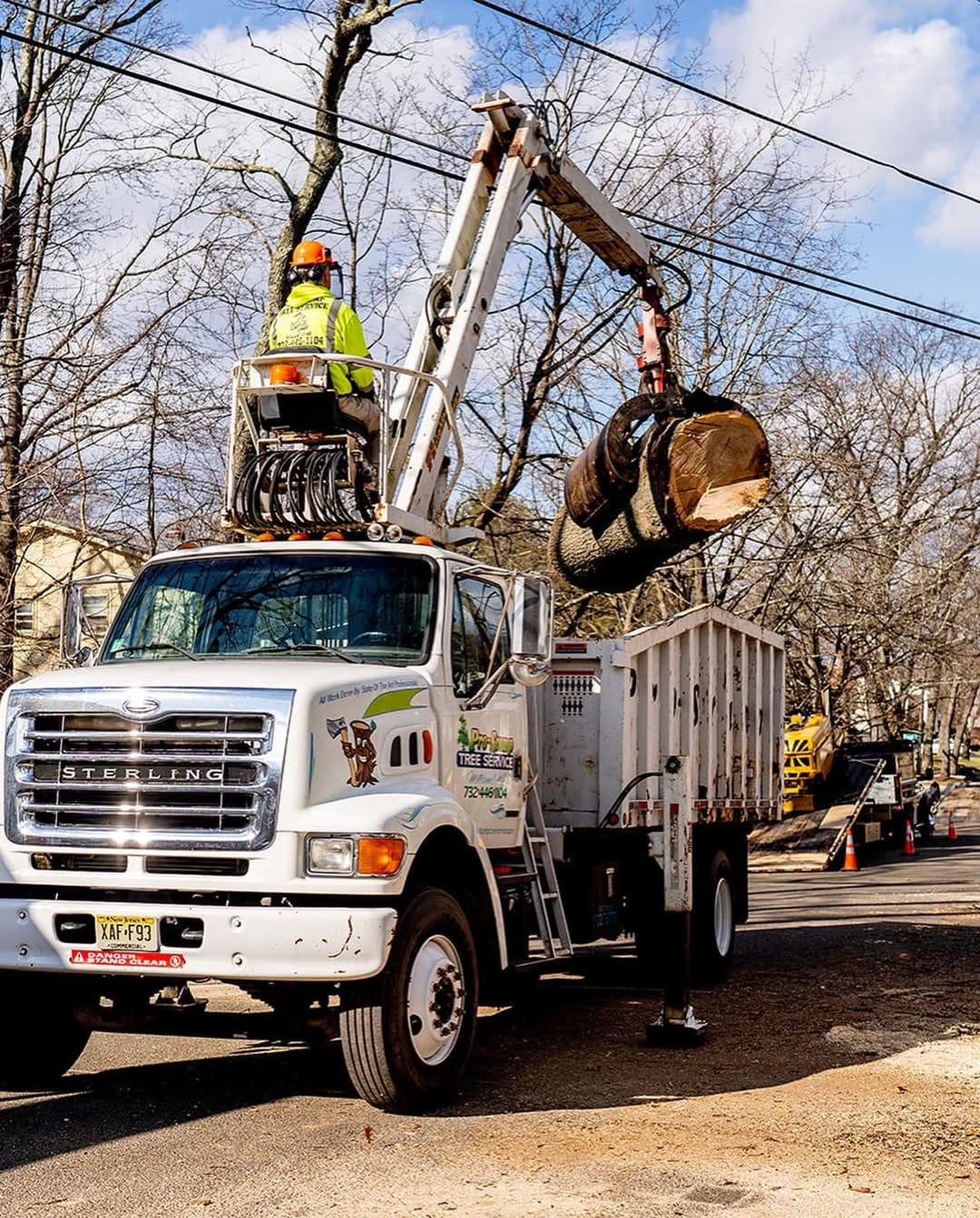 Wood truck hauling debris from a tree removal job